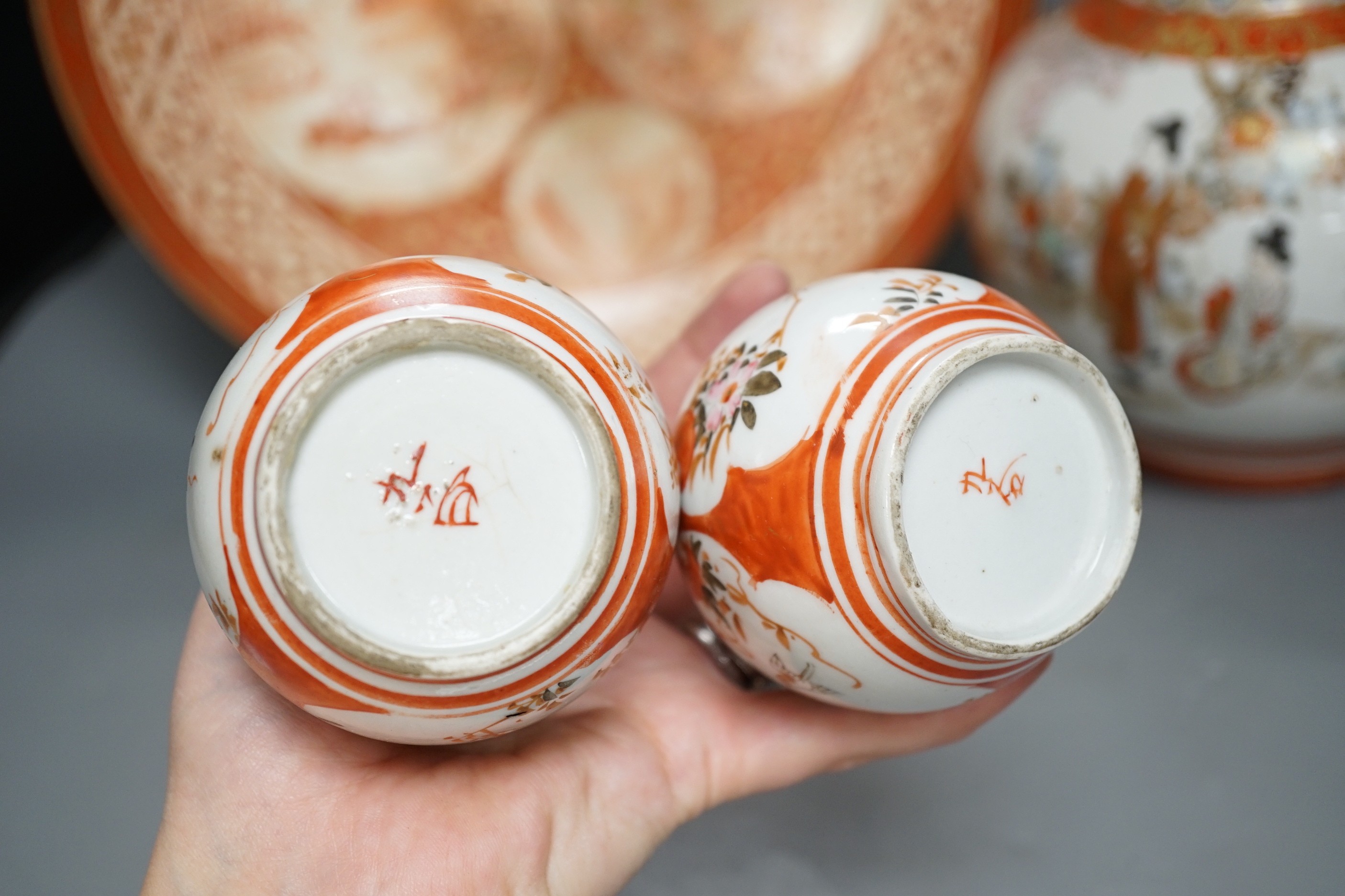 A 19th century Kutani bottle vase, a pair of smaller, similar vases and a large dish (4). Bottle vase 31cms high.